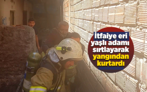 İtfaiye eri, yaşlı adamı sırtında taşıyıp, alevlerin arasından kurtardı